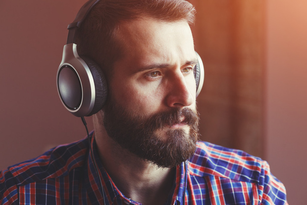 bearded man in headphones - Photo, image