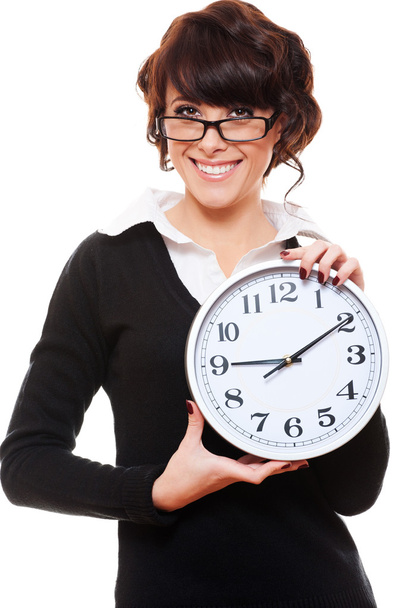 Businesswoman holding clock - Zdjęcie, obraz
