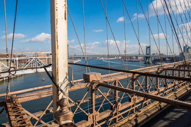 Brooklyn bridge in New York on bright summer day - Фото, зображення