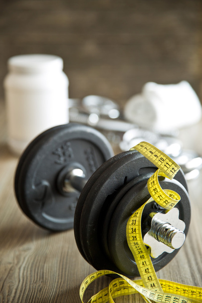 measuring tape and iron dumbbell - Photo, Image