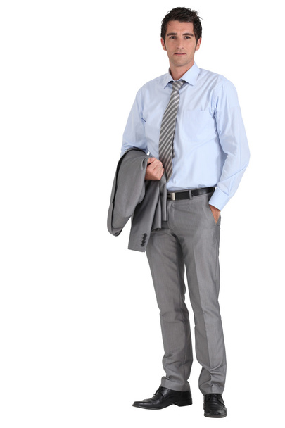 Businessman with jacket over arm - Photo, image