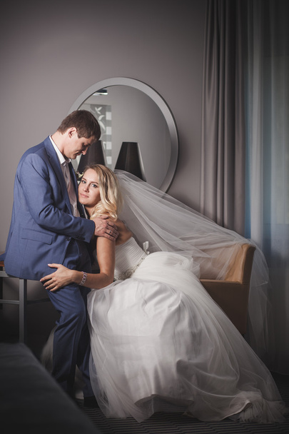 Bride embraces bridegroom - Valokuva, kuva