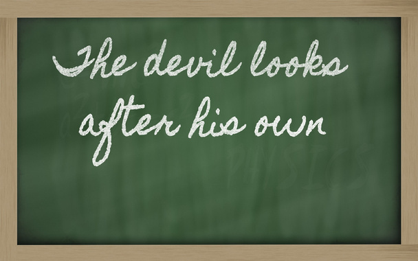 Expression - The devil looks after his own - written on a schoo - Photo, Image