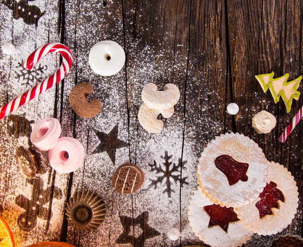 Christmas sweets over wooden background, close-up. - Zdjęcie, obraz