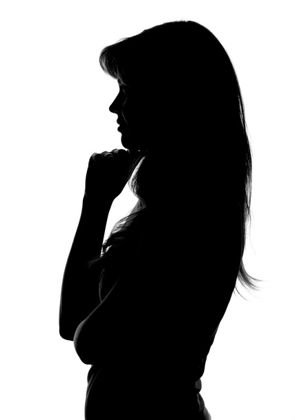 silhouette of a pensive woman on a white background - Fotoğraf, Görsel