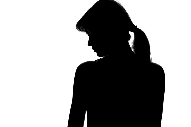 silhouette of a pensive woman on a white background - Fotoğraf, Görsel