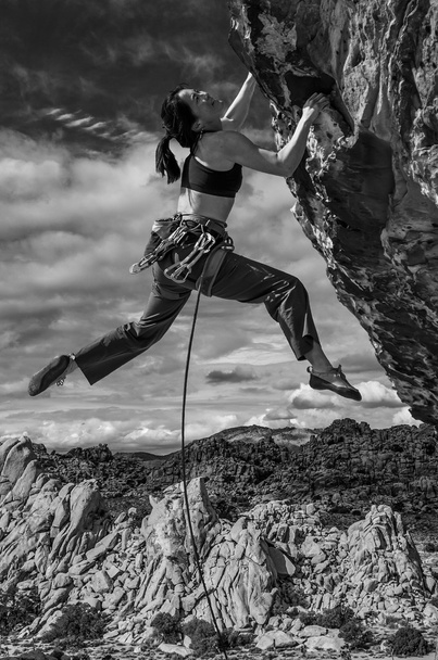Rock climber clinging to a cliff. - Photo, Image