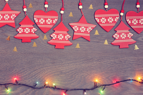 New Year's background: red decorations, confetti  and a garland - Valokuva, kuva