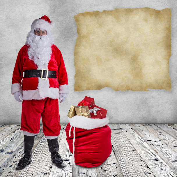 Santa Claus posing  on wooden background - Fotó, kép