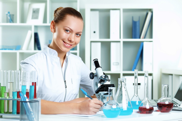 Young scientist working in laboratory - Fotó, kép