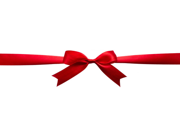 Red silk horizontal ribbon bow on white background isolated - Photo, Image