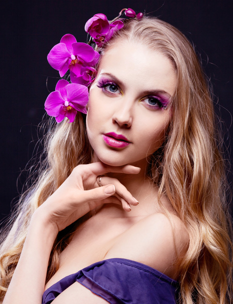 Woman with an orchid - Photo, image
