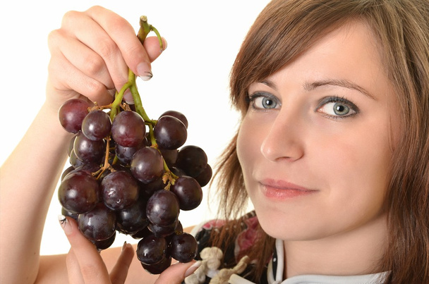 Красива молода жінка з виноградом
 - Фото, зображення