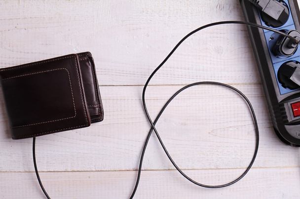 Wallet and charger. Making money, money attraction finance concept - Fotografie, Obrázek