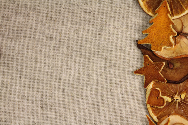 Dried fruits on Christmas background of gray natural fabric - Foto, Imagem