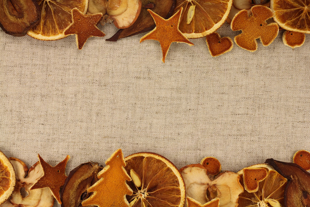 Dried fruits on Christmas background of gray natural fabric - Photo, Image