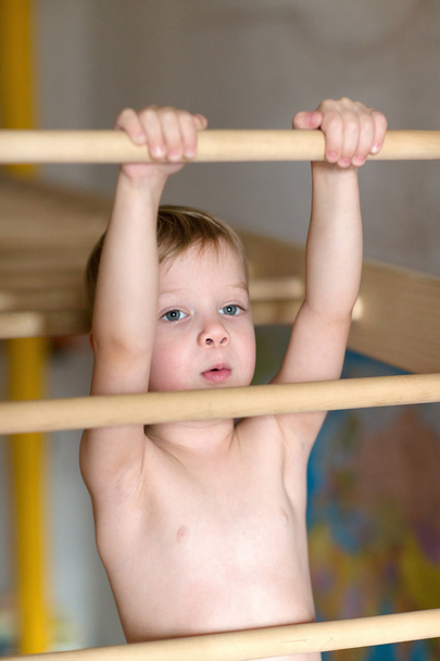 Boy hanging on the ladder. - Fotó, kép