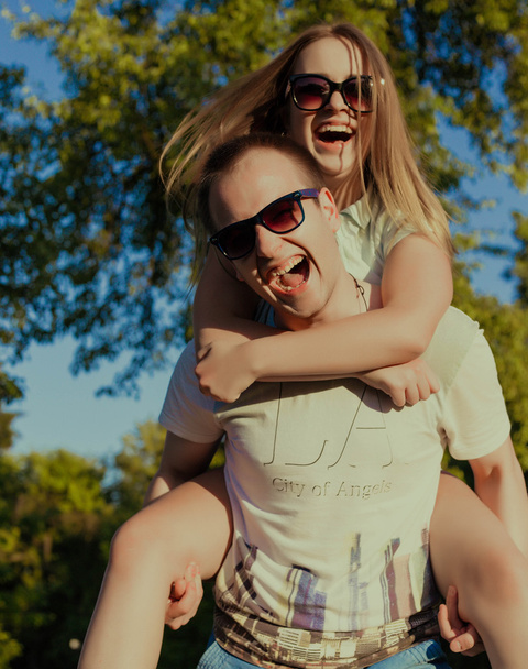 Funny couple in the sunglasses outdoor - Photo, image