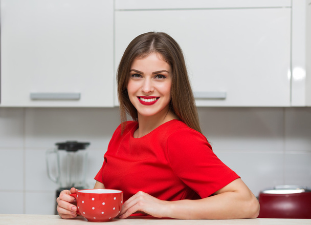 Glamorous housewife at her kitchen - Photo, Image