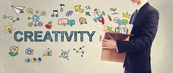 Creativity concept with businessman holding a box - Фото, зображення