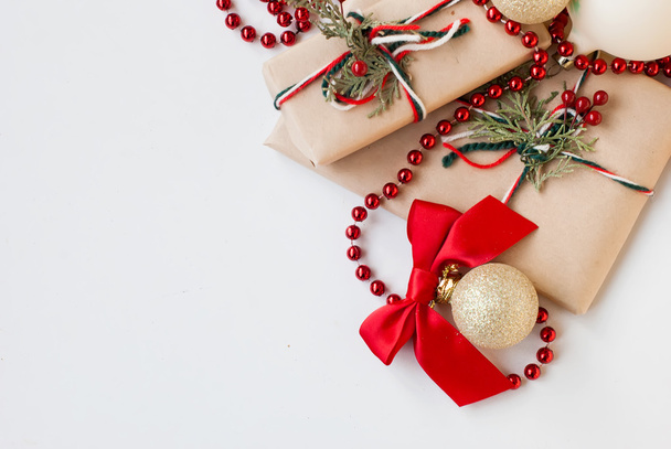 silver Christmas balls and gifts on wooden table - Valokuva, kuva