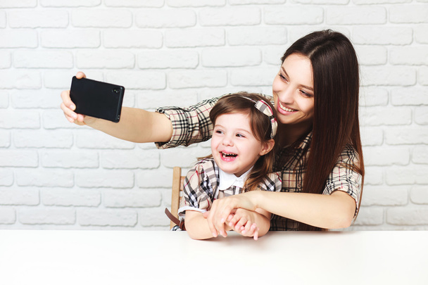 Mother and daughter doing selfie - Фото, зображення