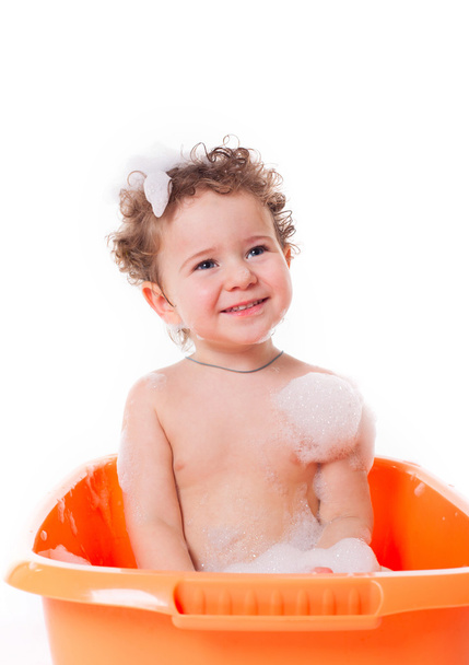 Cute happy baby playing with foam in bath - Foto, Imagem