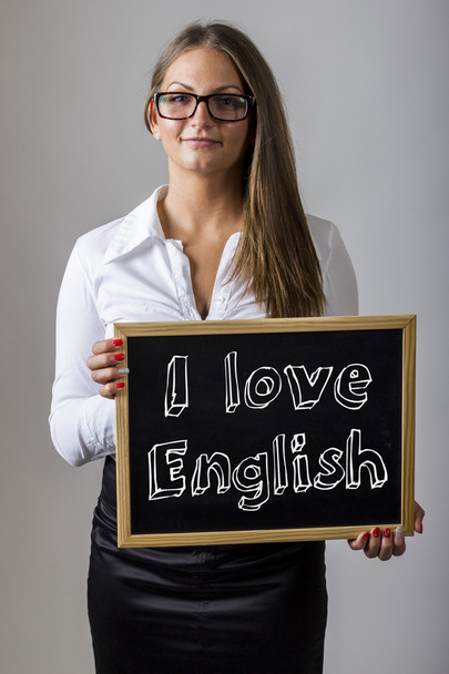 Αγαπώ Αγγλικά - νεαρός επιχειρηματίας κρατώντας Μαυροπίνακας με tex - Φωτογραφία, εικόνα