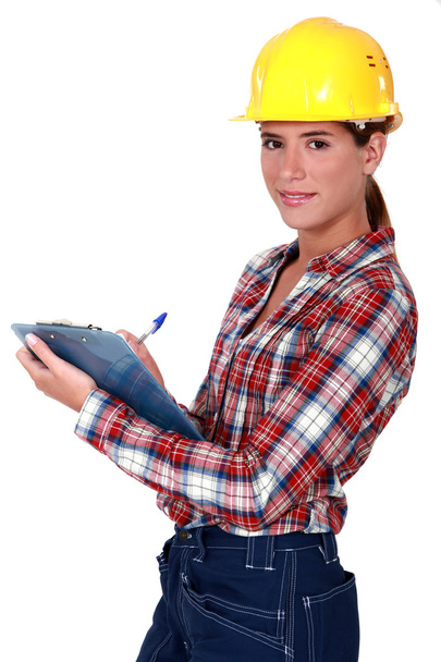 Female supervisor holding clipboard - 写真・画像