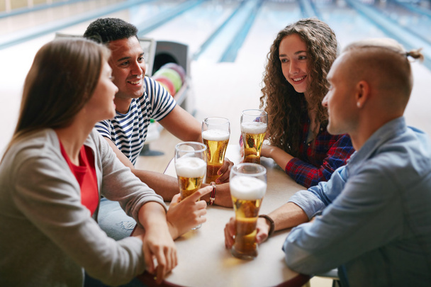 friends having beer after bowling - 写真・画像