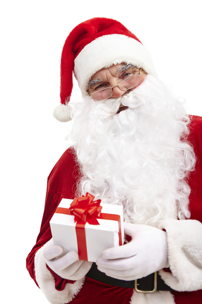 Babbo Natale in possesso di scatola regalo rossa
 - Foto, immagini