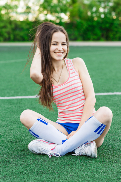 smiling girl on the soccer field - Фото, зображення