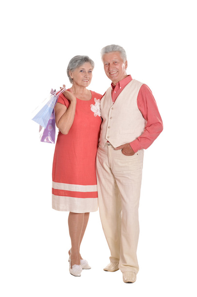 Elderly couple and shopping bags - 写真・画像