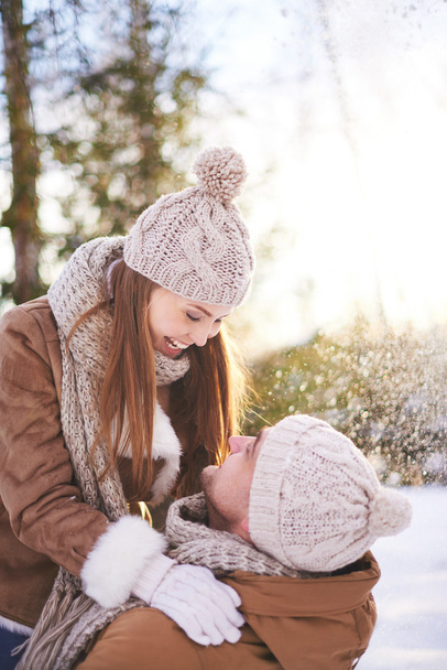 couple playing together outdoors in winter - Photo, Image