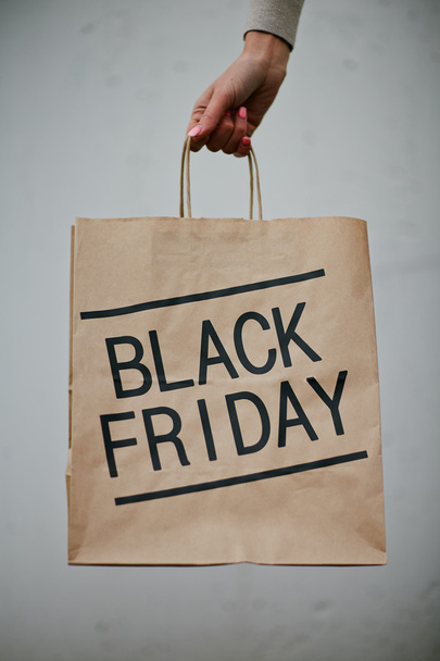 Black Friday shopping bag in hand - Photo, Image