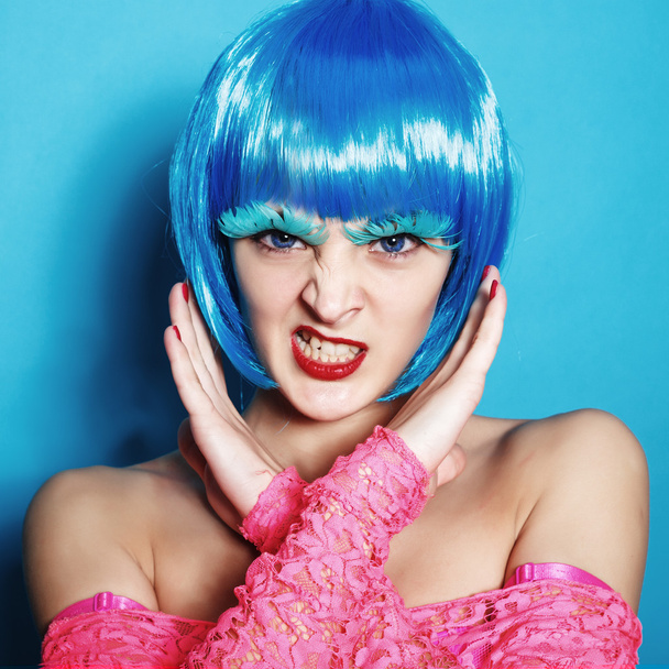 Sexy dancer girl in the blue wig hair in the studio portrait - Foto, afbeelding