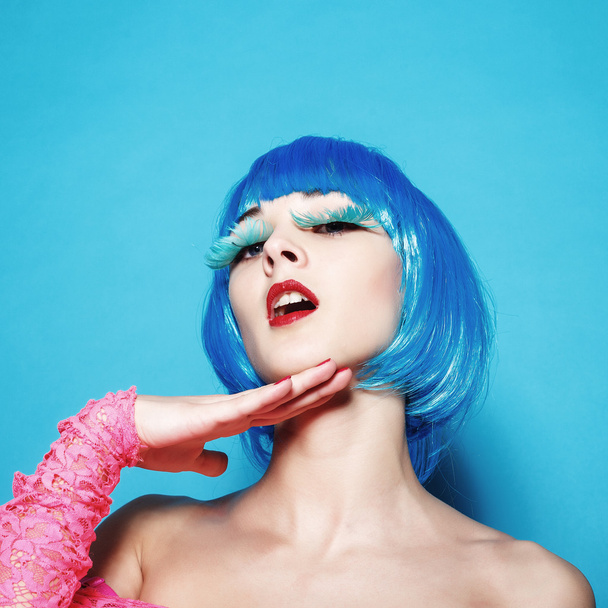 Sexy dancer girl in the blue wig hair in the studio portrait - Photo, Image