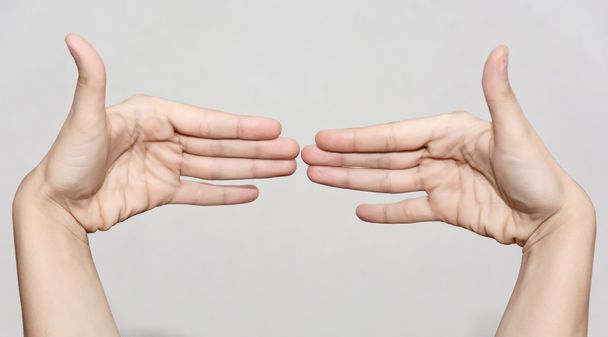Female hands making funny shape - Photo, Image