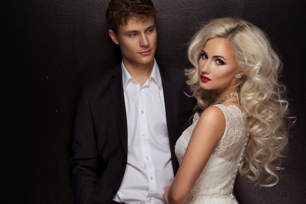 Photo of a young couple in sensual lingerie and suit - Photo, Image