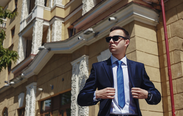 Portrait of an handsome businessman in an urban setting - Фото, зображення