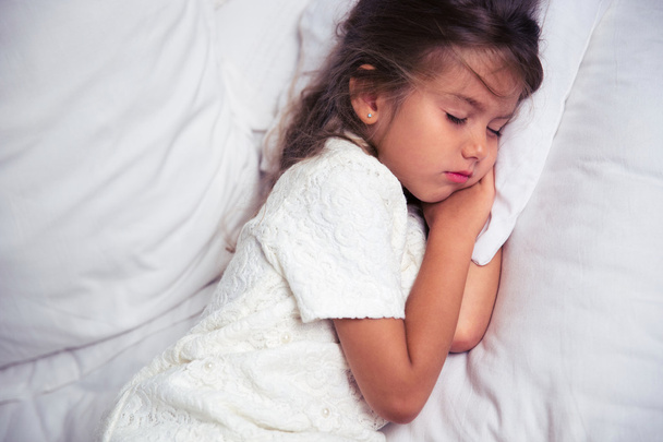 Little girl resting in bed - Photo, Image