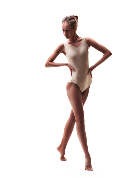 young beautiful dancer in beige swimsuit - Fotoğraf, Görsel