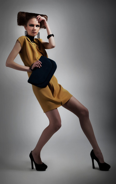 Elegant fashionable artistic girl in studio posing - Foto, Imagem