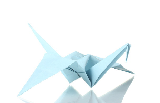 Origami crane out of the blue paper isolated on white - Fotoğraf, Görsel