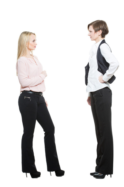 two businesswomen, isolated on white background. body language, gestures psychology. paired gestures. conflict situation. aggressive posture ready. negativity - Zdjęcie, obraz