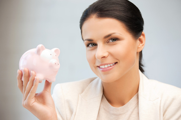 Lovely woman with piggy bank - Foto, immagini