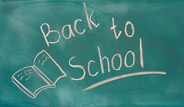 Back to school written on green chalkboard - Photo, image