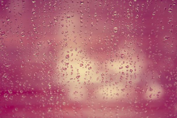 rain drop on window glass with blur tree background, vintage col - Photo, Image