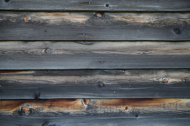 Closeup of  rouph burnt weathered planks - Foto, afbeelding