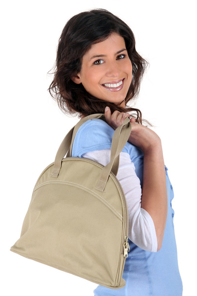Portrait of a young woman with handbag - Fotó, kép